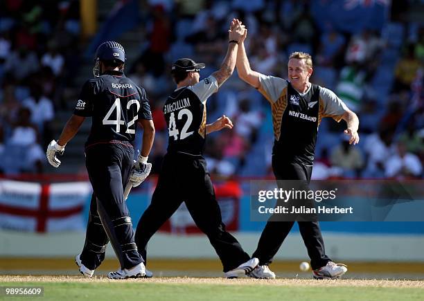 Brendon McCullum and Scott Styris of New Zealand celebrate the wicket of Ravi Bopara during the ICC World Twenty20 Super Eight match between England...