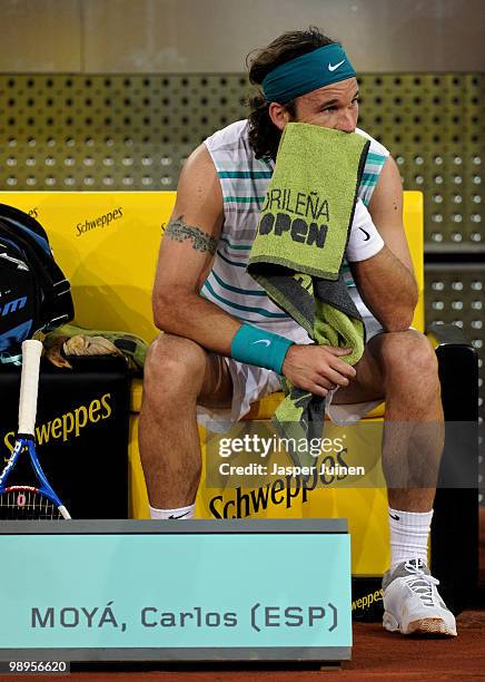 Carlos Moya of Spain during a break in first round match against Benjamin Becker of Germany during the Mutua Madrilena Madrid Open tennis tournament...