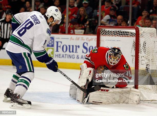 Antti Niemi of the Chicago Blackhawks stops a shot by Steve Bernier of the Vancouver Canucks in Game Five of the Western Conference Semifinals during...