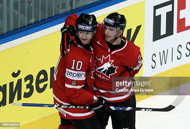 John Tavares of Canada celebrates his team's fourth goal with team mate Corey Perry during the IIHF World Championship group B match between...