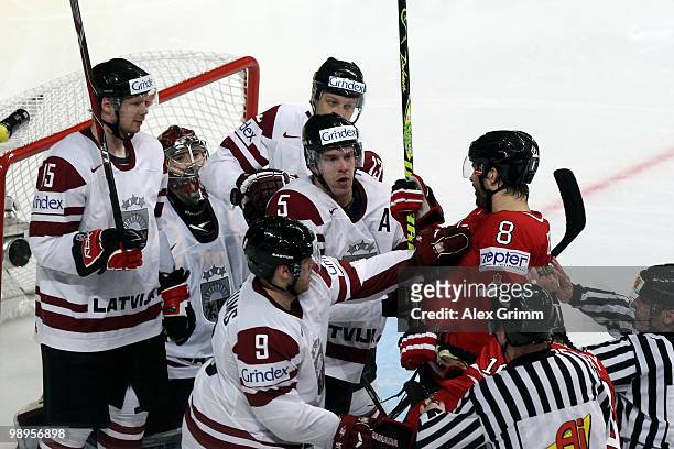 Brent Burns of Canada fights with players of Latvia during the IIHF World Championship group B match between Switzerland and Italy at SAP Arena on...