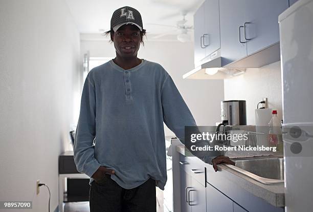 Standing in his kitchen, Tom Wyatt is one of the early tenants to rent a room April 21, 2010 in the newly opened Charles Cobb Apartments in downtown...