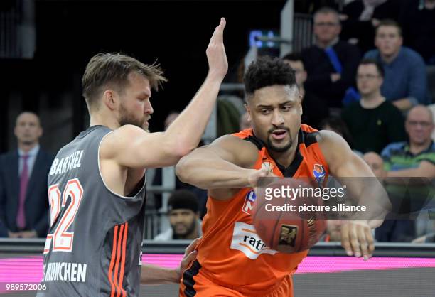 Dpatop - Ulm's Jerrelle Benimon and Munich' Danilo Barthel vie for the ball during the German Bundesliga basketball game between ratiopharm Ulm and...