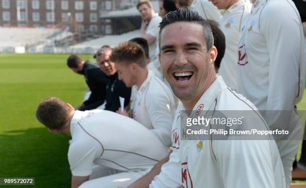 Kevin Pietersen of Surrey laughs as the team prepares for the team photograph at The Oval, London, 9th April 2015.