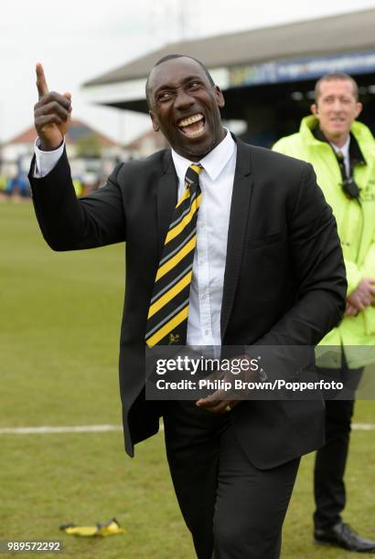 Burton Albion manager Jimmy Floyd Hasselbaink celebrates the League title after winning the Sky Bet League Two match between Cambridge United and...