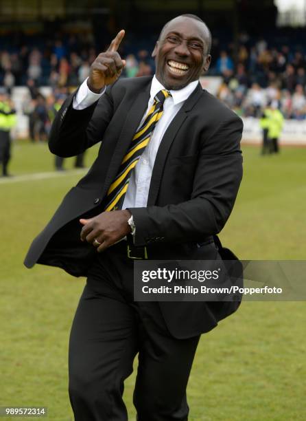 Burton Albion manager Jimmy Floyd Hasselbaink celebrates the League title after winning the Sky Bet League Two match between Cambridge United and...