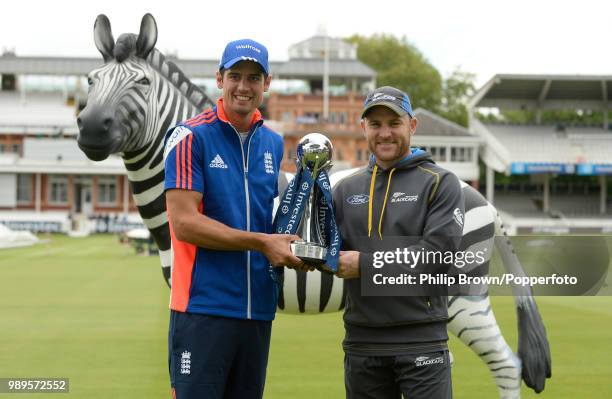 Team captains Alastair Cook of England and Brendon McCullum of New Zealand hold the Investec Series trophy before the 1st Test match between England...