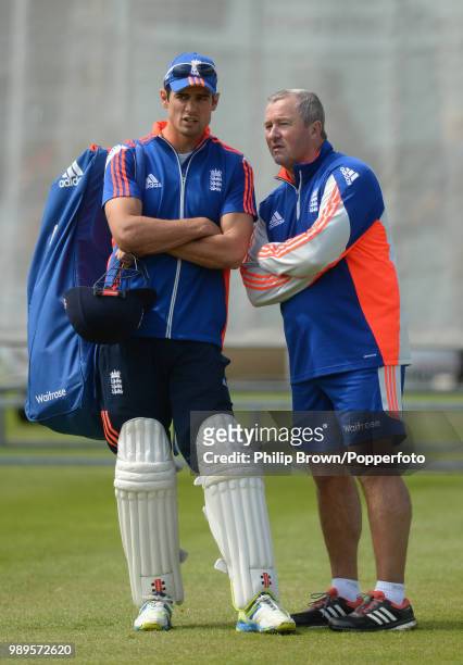 England's interim coach Paul Farbrace talks with team captain Alastair Cook during a training session before the 1st Test match between England and...