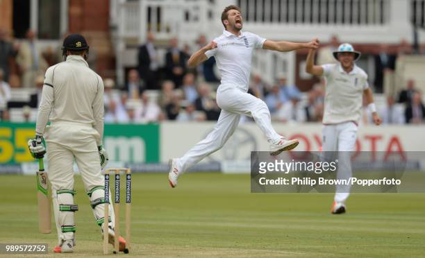 Mark Wood of England celebrates prematurely after thinking he had dismissed Martin Guptill of New Zealand only for the delivery to be ruled a no ball...