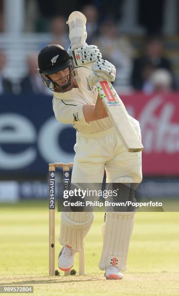 Kane Williamson of New Zealand drives back down the ground during his innings of 132 in the 1st Test match between England and New Zealand at Lord's...