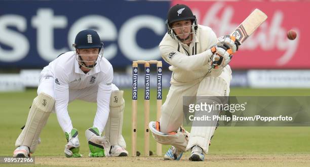 Watling of New Zealand prepares to reverse sweep the ball as England wicketkeeper Jos Buttler looks on during the 1st Test match between England and...