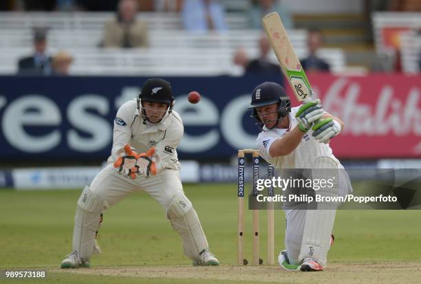 England batsman Ian Bell hits out watched by Tom Latham of New Zealand during the 1st Test match between England and New Zealand at Lord's Cricket...