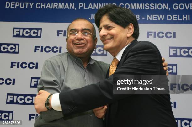 Salman Faruqui, Deputy Chairman of Planing Commission of Pakistan, is greeted by former president of the FICCI, K.K.Modi during the interactive...