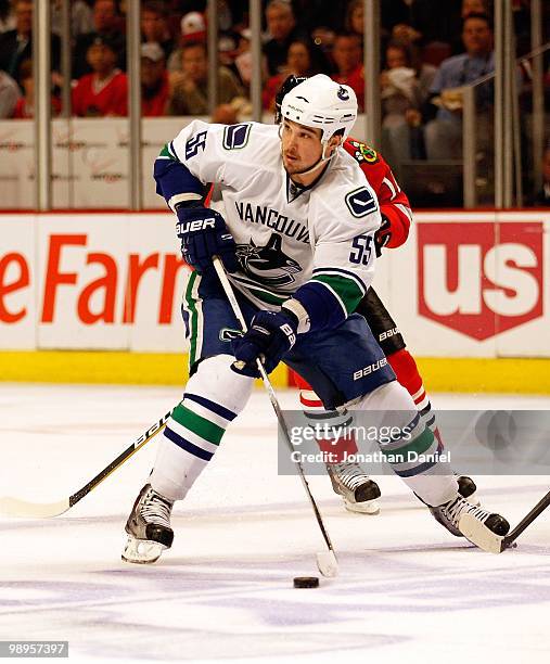 Shane O'Brien of the Vancouver Canucks looks to pass against the Chicago Blackhawks in Game Five of the Western Conference Semifinals during the 2010...