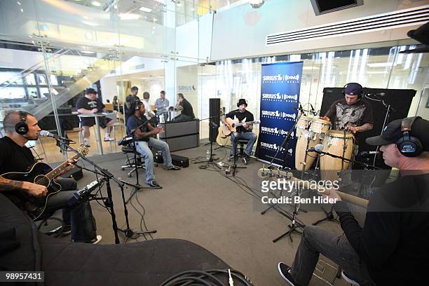 Guitarist Clint Lowery, singer Lajon Witherspoon, guitarist John Connolly, drummer Morgan Rose and guitarist Vinnie Hornsby of Sevendust perform at...