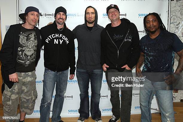 Drummer Morgan Rose, guitarist John Connolly, guitarist Clint Lowery, guitarist Vinnie Hornsby and singer Lajon Witherspoon of Sevendust pose at...