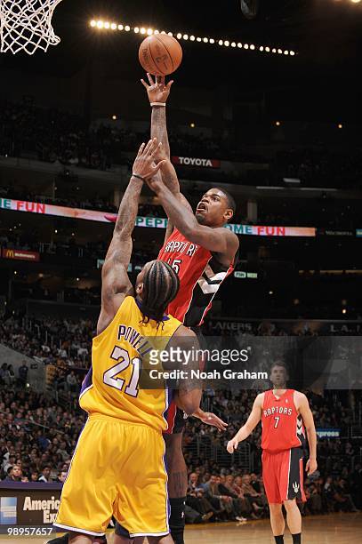 Amir Johnson of the Toronto Raptors makes a jumpshot against Josh Powell of the Los Angeles Lakers at Staples Center on March 9, 2010 in Los Angeles,...