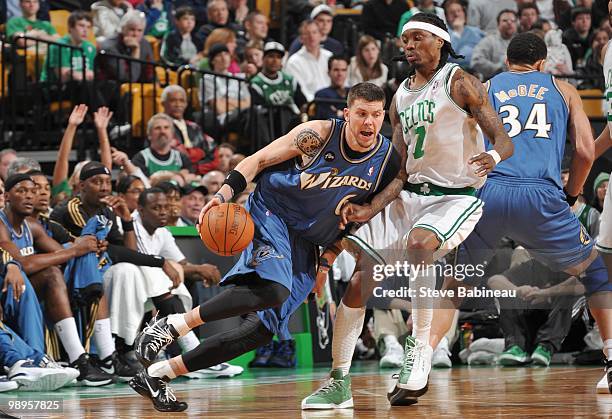 Mike Miller of the Washington Wizards drives the ball against Marquis Daniels of the Boston Celtics on March 7, 2010 at the TD Garden in Boston,...