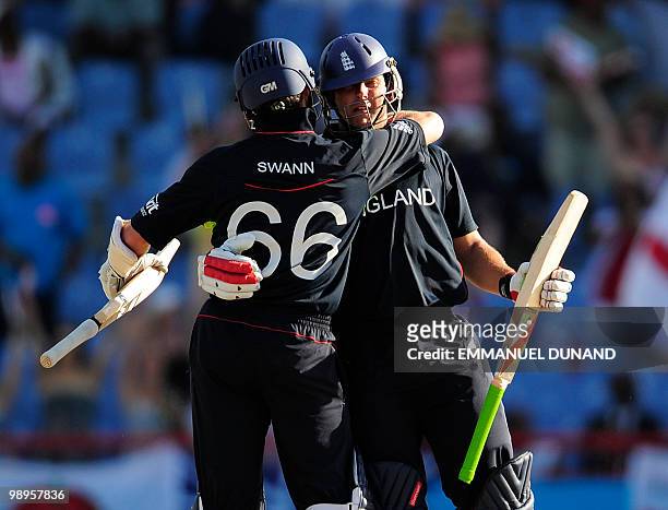 English batsman Tim Bresnan is congratulated by teammate Graeme Swann after hitting England's winning run during the ICC World Twenty20 Super Eight...