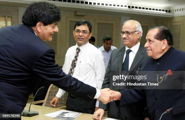 Salman Faruqui, Deputy Chairman of Planing Commission of Pakistan, shakes hands with the members of FICCI during the interactive business meeting at...