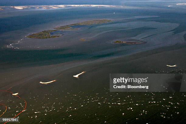 Oil surrounds one of the Chandeleur Islands in Louisiana, U.S., on Saturday, May 8, 2010. Oil has been gushing from the Macondo well at an estimated...