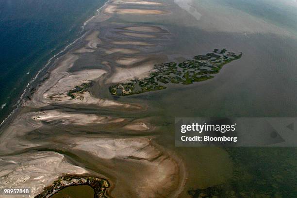 Oil hits the shore of the Chandeleur Islands in Louisiana, U.S., on Saturday, May 8, 2010. Oil has been gushing from the Macondo well at an estimated...