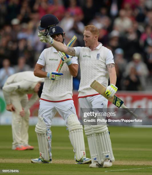 Ben Stokes of England celebrates reaching his century during his innings of 101 runs as captain Alastair Cook applauds him in the 1st Test match...