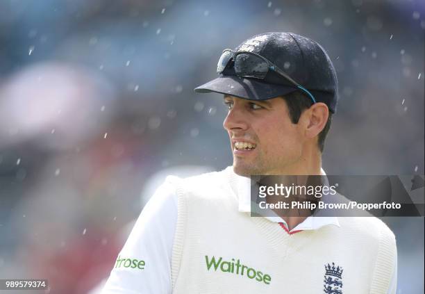 England captain Alastair Cook leaves the field as rain stops play on day one of the 2nd Test match between England and New Zealand at Headingley,...