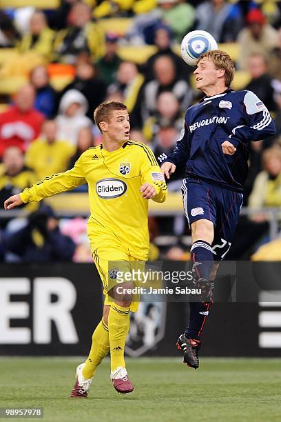 Seth Sinovic of the New England Revolution heads the ball in front of Robbie Rogers of the Columbus Crew on May 8, 2010 at Crew Stadium in Columbus,...