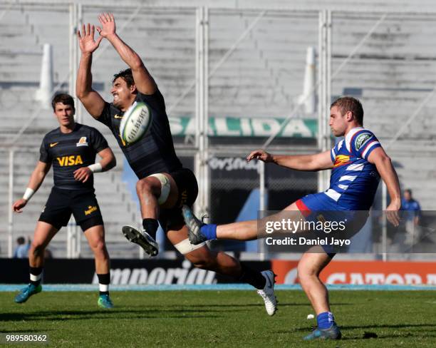 Jean Luc du Plessis of Stormers kicks the ball as Pablo Matera of Jaguares attempts to block it during a match between Jaguares and Stormers as part...