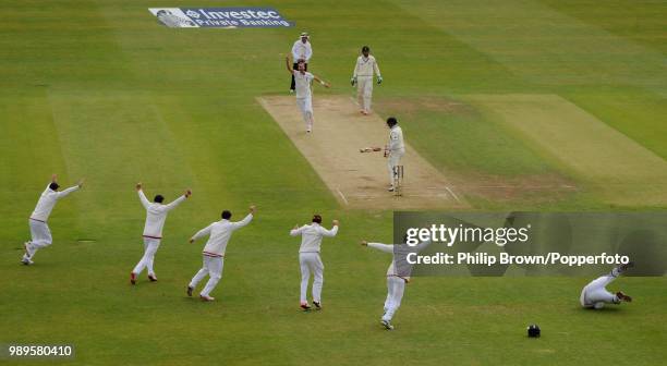Tom Latham of New Zealand is caught by England wicketkeeper Jos Buttler off the bowling of Stuart Broad during the 2nd Test match between England and...