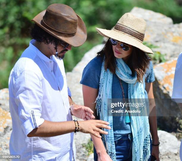 American model and actress Megan Fox receives information from Chair of Troy Antique City Excavation Committee and Canakkale Onsekiz Mart University...