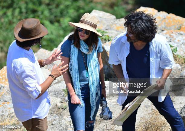 American model and actress Megan Fox receives information from Chair of Troy Antique City Excavation Committee and Canakkale Onsekiz Mart University...