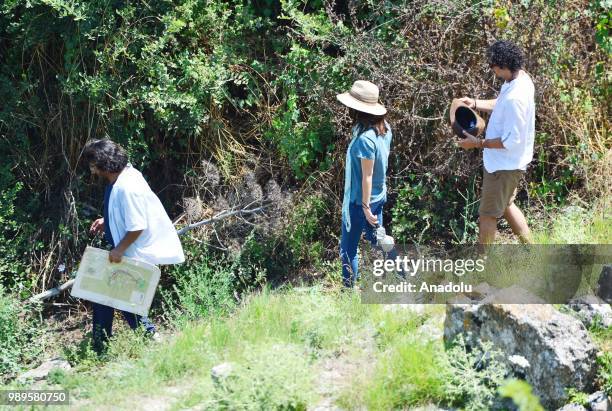 American model and actress Megan Fox receives information from Chair of Troy Antique City Excavation Committee and Canakkale Onsekiz Mart University...