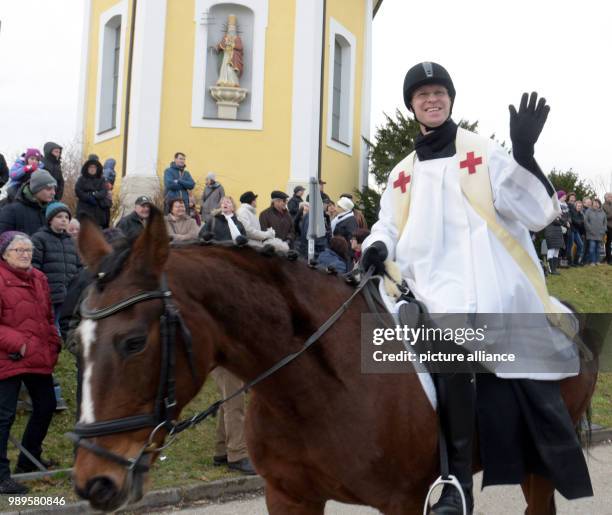 Priest Matthias Reiner on a horse during the traditional Silvesterritt in Westhausen, Germany, 31 December 2017. Around 230 riders met for the...