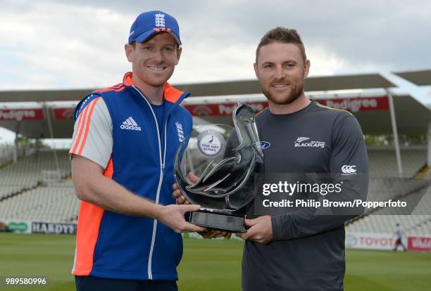 Team captains Eoin Morgan of England Brendon McCullum of New Zealand stand with the Royal London series trophy before the 1st One Day International...