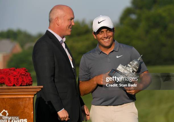 Quicken Loans Vice Chairman Bill Emerson presents Francesco Molinari of Italy with the trophy after winning the Quicken Loans National at TPC Potomac...