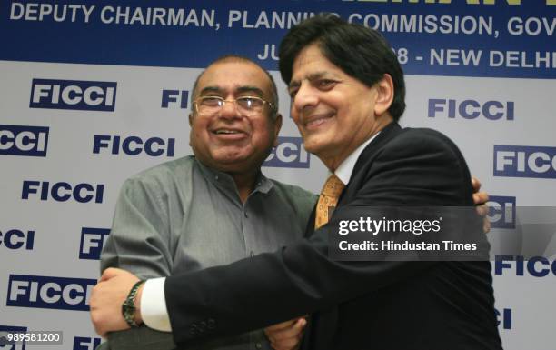 Salman Faruqui, Deputy Chairman of Planing Commission of Pakistan, is greeted by former president of the FICCI, K.K.Modi during the interactive...