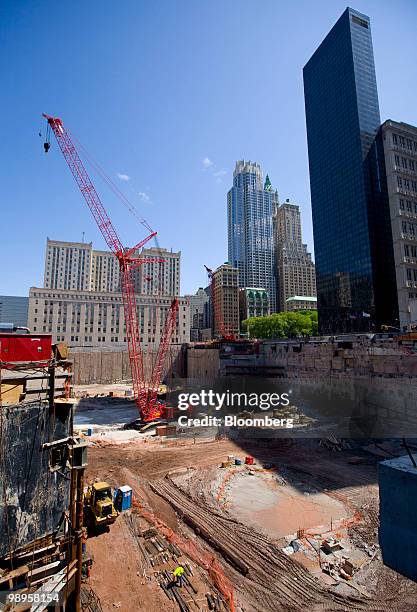 Crane sits in a foundation pit for a building at the World Trade Center construction site in New York, U.S., on Monday, May 10, 2010. One World Trade...