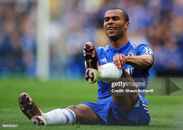 Ashley Cole of Chelsea adjusts his socks during the Barclays Premier League match between Chelsea and Wigan Athletic at Stamford Bridge on May 9,...