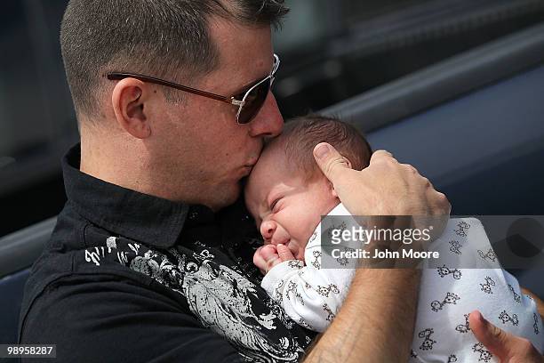 Army National Guardsman Ssg. Daniel Morris kisses his one-month-old son Avery after a deployment ceremony on May 10, 2010 in Centennial, Colorado. He...