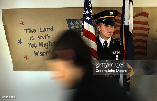 An honor guard holds the colors during a deployment ceremony on May 10, 2010 in Centennial, Colorado. A dozen Colorado Army National Guardsmen...