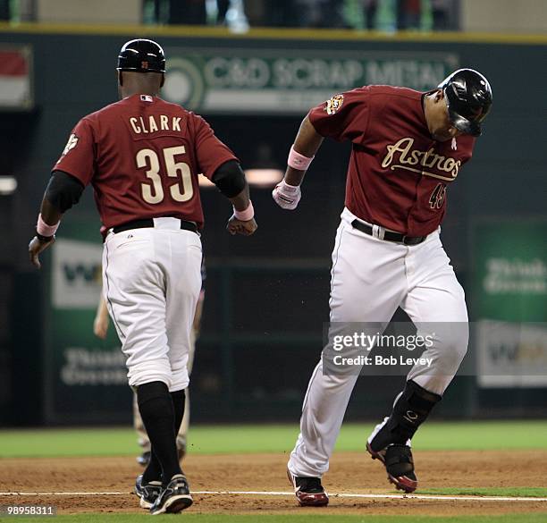 Carlos Lee of the Houston Astros runs past third base coach Dave Clark after hitting a home run in the sixth inning against the San Diego Padres at...