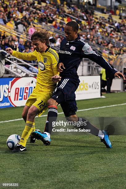 Eddie Gaven of the Columbus Crew and Khano Smith of the New England Revolution battle for the ball on May 8, 2010 at Crew Stadium in Columbus, Ohio.