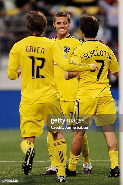 Eddie Gaven, Robbie Rogers and Guillermo Barros Schelotto, all of the Columbus Crew, celebrate a goal against the New England Revolution on May 8,...