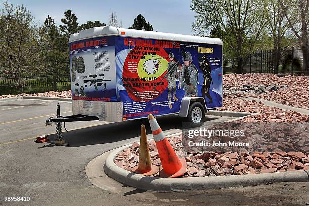 Colorado Army National Guard trailer used for recruiting sits outside a ceremony for soldiers being sent to Afghanistan on May 10, 2010 in...