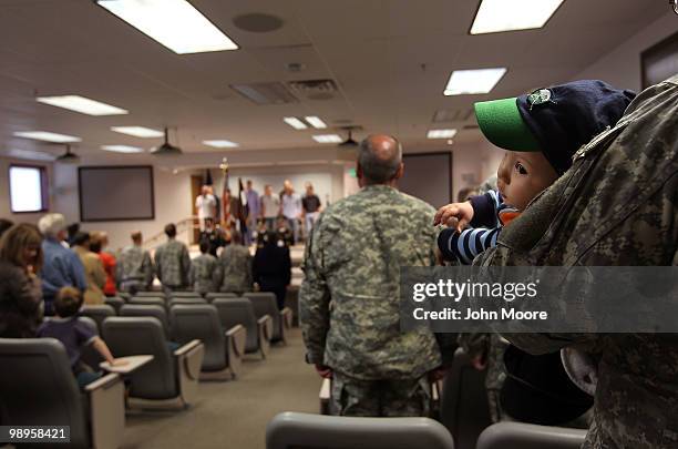 Family and friends attend a deployment ceremony for soldiers being sent to Afghanistan on May 10, 2010 in Centennial, Colorado. A dozen Colorado Army...