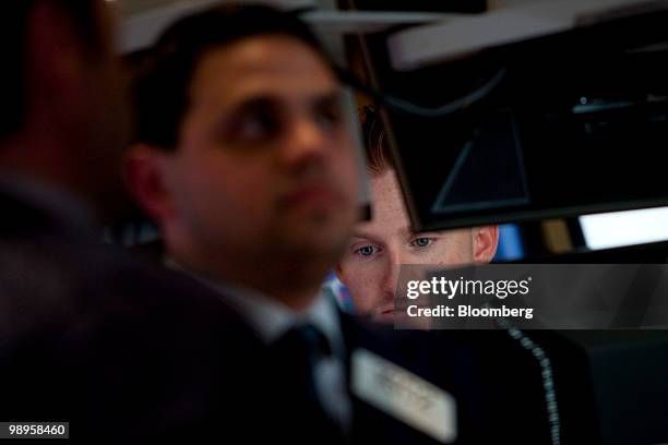 Traders work on the floor of the New York Stock Exchange in New York, U.S., on Monday, May 10, 2010. Stocks rallied around the world, sending the...