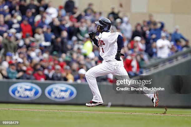 Orlando Hudson of the Minnesota Twins runs to third on a triple against the Detroit Tigers on May 5, 2010 at Target Field in Minneapolis, Minnesota....