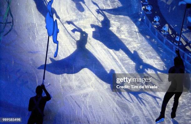 Winter Olympic Games : Salt Lake City, 02/8/2002, Salt Lake City, Utah, United States --- Animals Are Silhouetted On The Ice As Skaters Circle The...